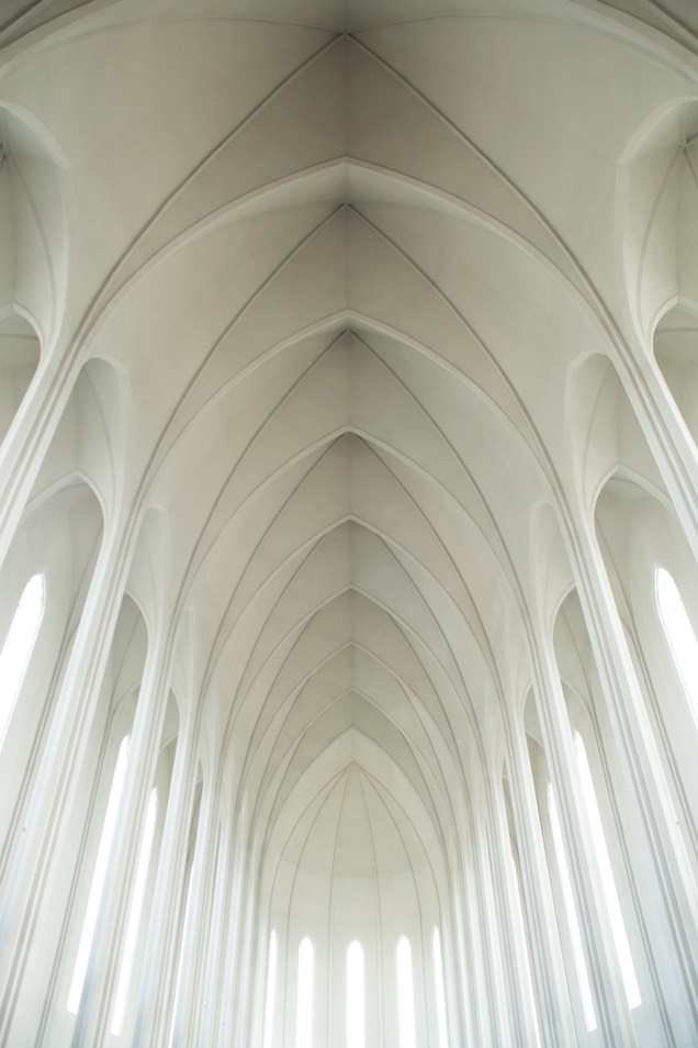 High white arches in a long building.